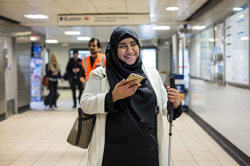 A vision impaired person taking part in the London Euston trial